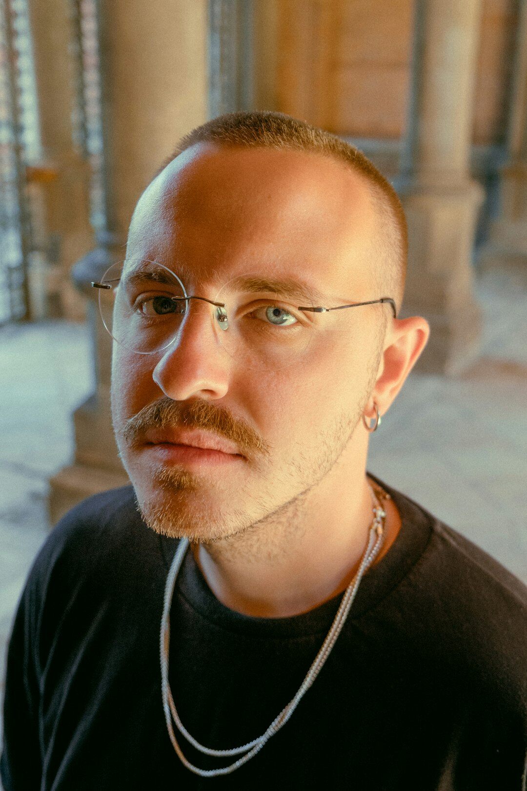 Studio portrait of a man with glasses and short beard