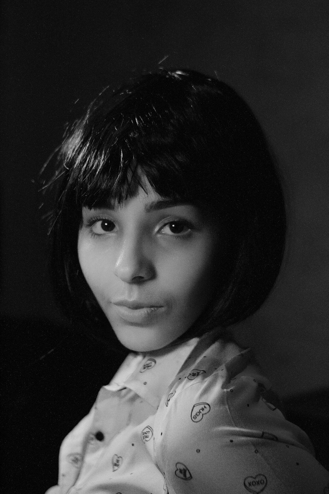 Studio portrait of a woman with short dark hair smiling