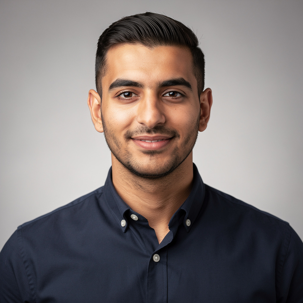 Studio portrait of a man with short hair and a confident look